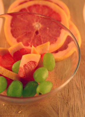 slices of fruits in bowl colorful